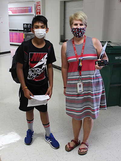 Shorewood Intermediate School Counselor, Julie Wells, walks with a student in the school hallway